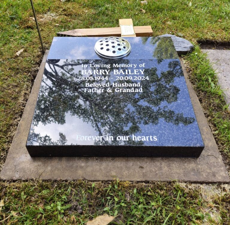 Black granite memorial tablet with gold inscription