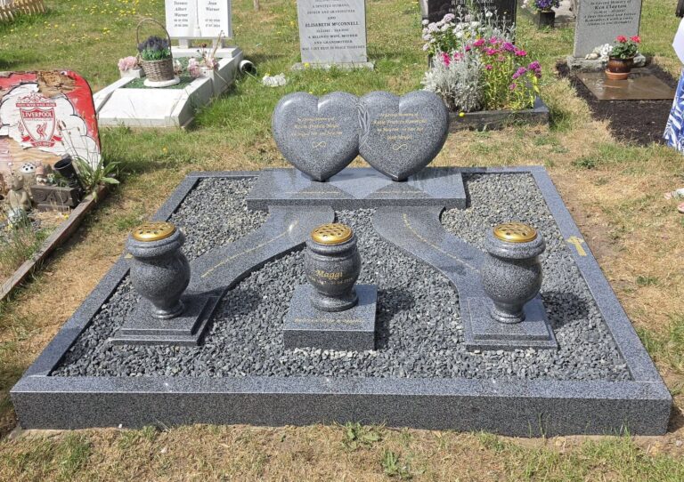 Double heart-shaped black granite memorial
