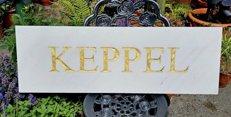 Engraved stone house name sign