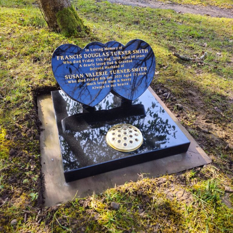 Heart-shaped black granite headstone
