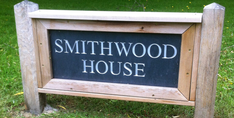 Smithwood House name sign in engraved slate set in an oak post frame